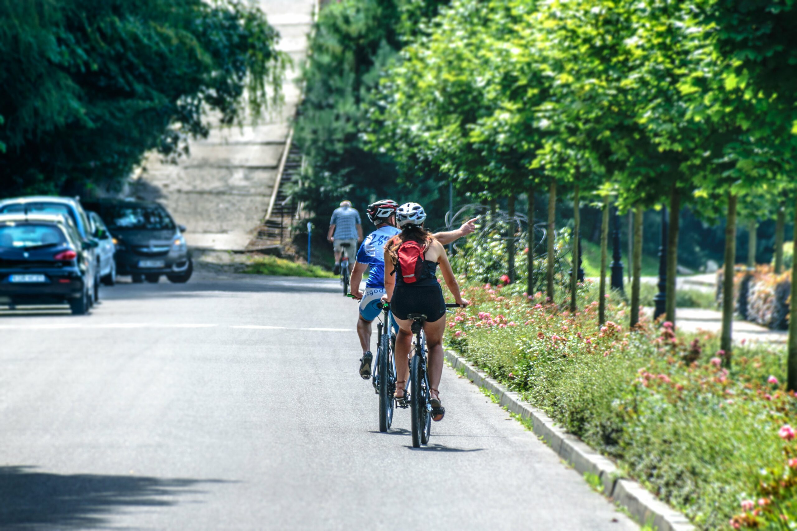 Canva - Man and Woman Riding Bicycle
