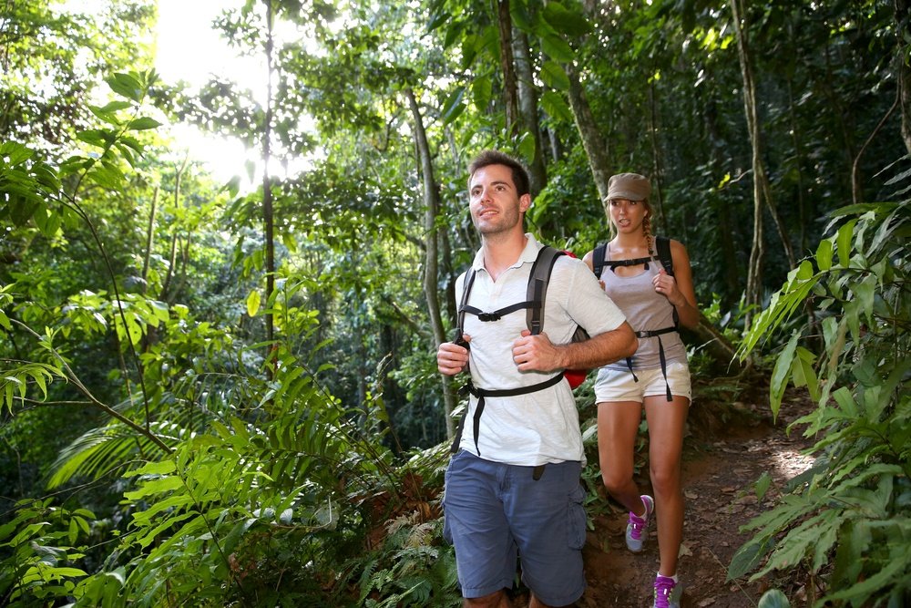 Couple on a trekking day in tropical forest.jpeg